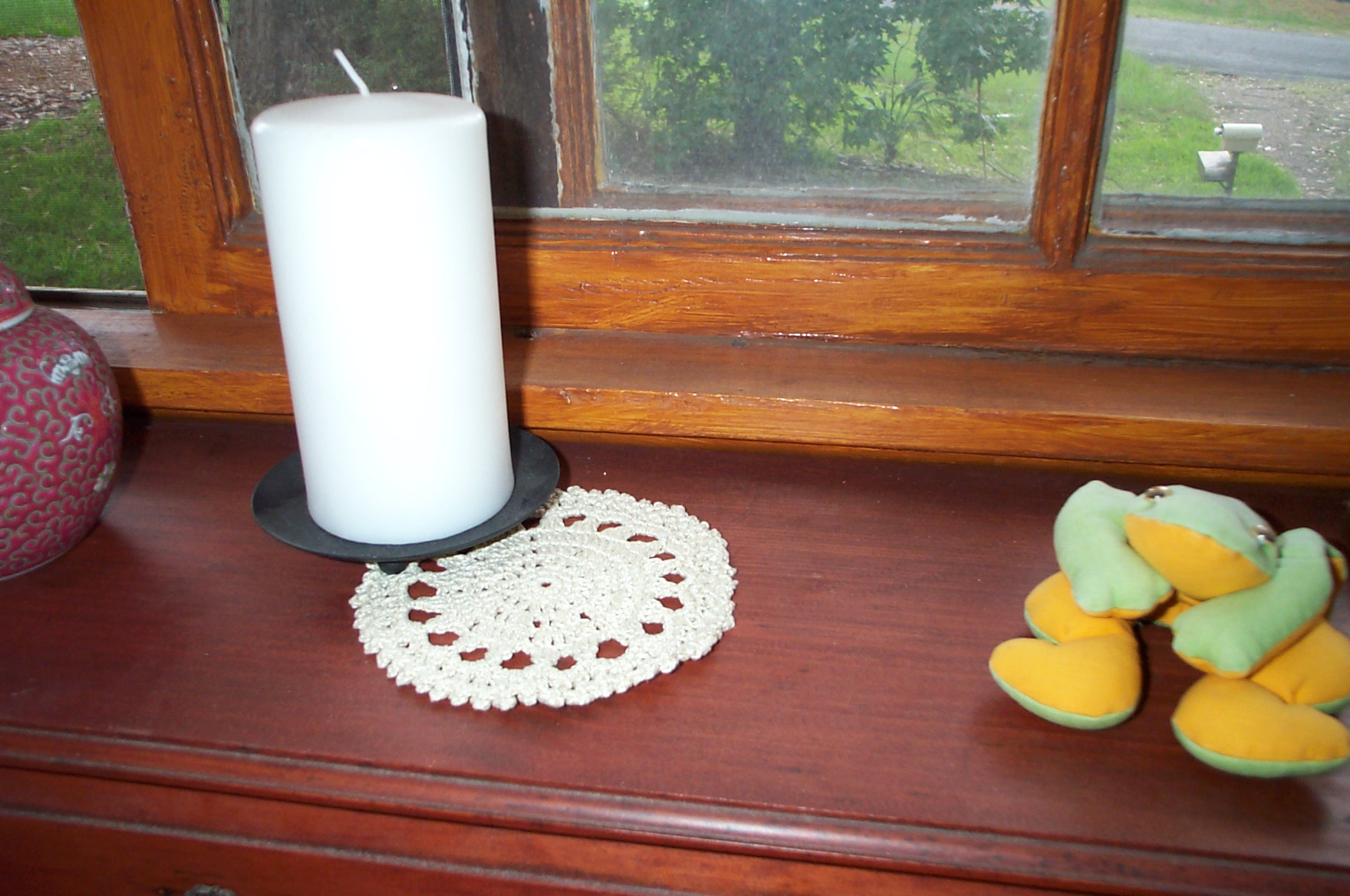 Small doily to protect wood from the candle holder